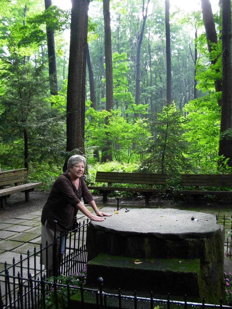 This is Inspiration Stump where there is a meeting twice a day for the visitors to get readings from several mediums.  The readings are spontaneous like what you see on the John Edwards TV Show.  People put stones (people who believe in the power of stones) on the stump hoping to increase the power of their stone, or rock.