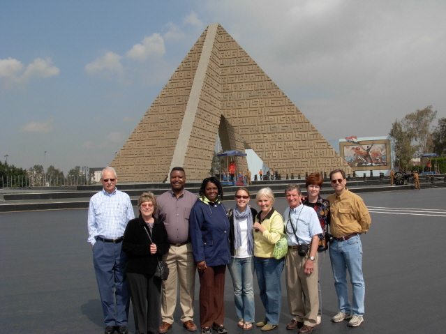 This is the troop of nine; Sameh is taking the picture.  He was good at this when he wasn't yelling back to me to stop taking pictures and follow the group.A sad moment as we visit the memorial where Sadat is buried.  Across the street from the memorial is the stadium where he gave a speech just before he was shot